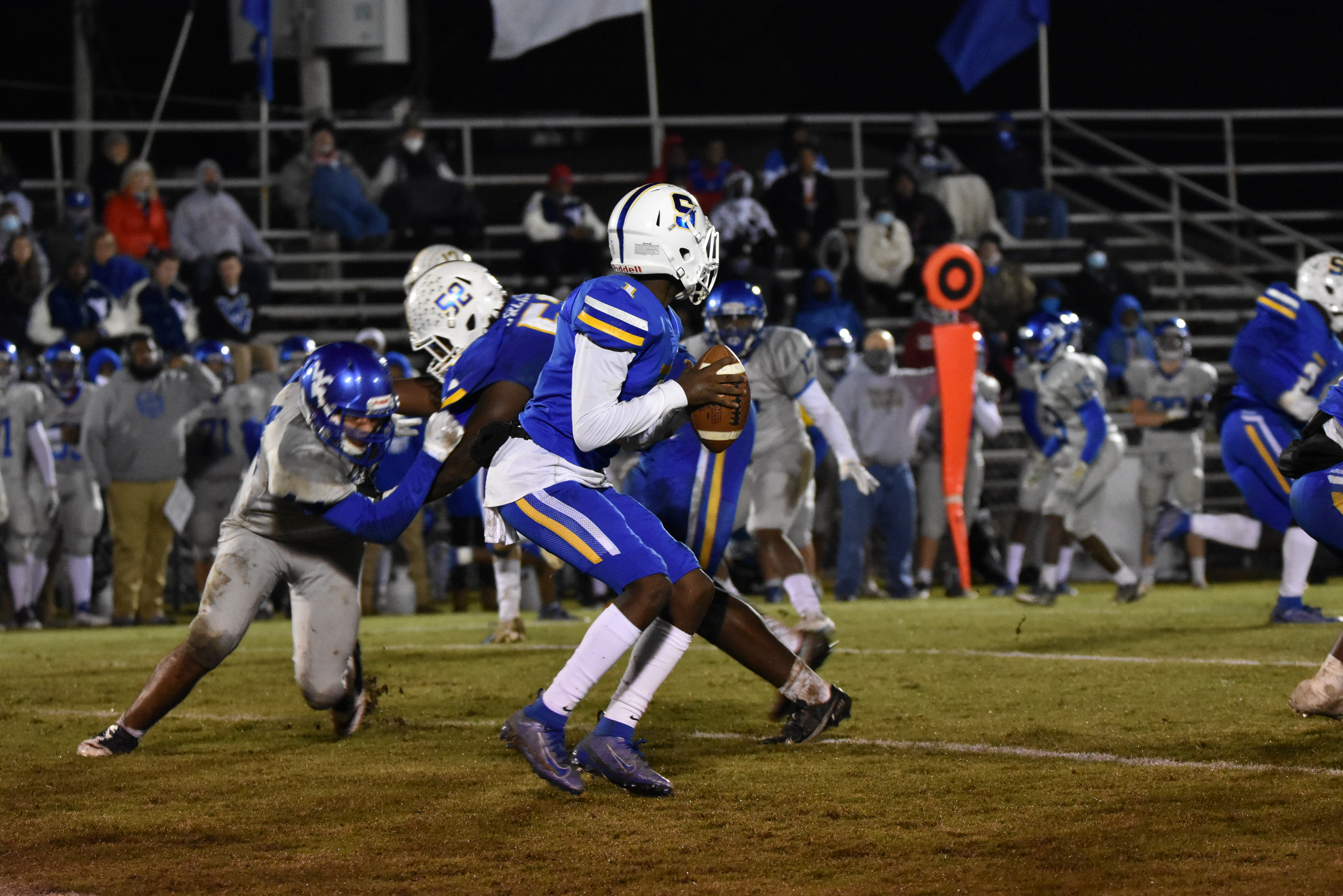 Ty Hullette, 1, checks down looking for a pass