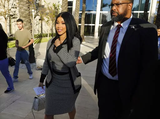 Cardi B exits federal court as proceedings continue in a $5 million copyright infringement lawsuit against her in federal court, Wednesday, Oct. 19, 2022, in Santa Ana, Calif. Kevin Michael Brophy is suing the Grammy-winning musician for allegedly misusing his likeness for her sexually suggestive mixtape cover art in 2016. (AP Photo/Chris Pizzello)