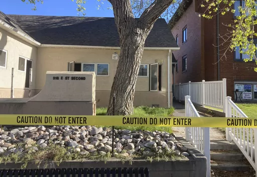 The fire-damaged Wellspring Health Access clinic is cordoned by tape on May 25, 2022, in in Casper, Wyo. A woman was arrested for setting fire to the building in Wyoming that was being renovated to house the state’s only full-service abortion clinic, authorities said Wednesday, March 22, 2023. (AP Photo/Mead Gruver, File)