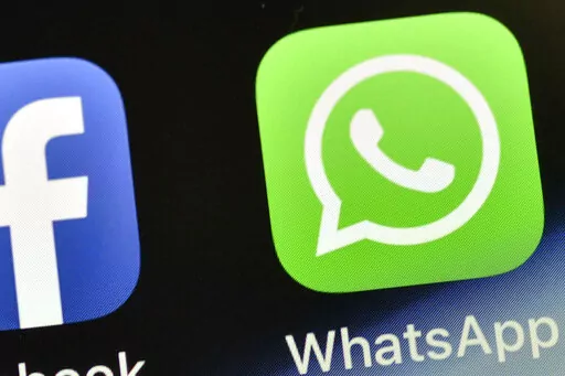 The WhatsApp icon is seen on an iPhone in Gelsenkirchen, Germany, on Nov. 15, 2018. People around the world are reporting problems sending and receiving messages on the popular chat app WhatsApp. According to Downdetector, which tracks outage reports, people started reporting problems around 3 a.m. EDT. on Tuesday, Oct. 24, 2022. (AP Photo/Martin Meissner, File)