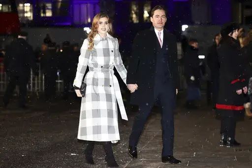 Britain's Britain's Princess Beatrice and Edoardo Mapelli Mozzi attend the Together At Christmas carol service at Westminster Abbey, in London, Dec. 15, 2022. (Henry Nicholls/Pool Photo via AP, File)