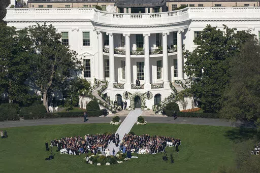 President Joe Biden's granddaughter Naomi Biden and her fiance, Peter Neal, are married on the South Lawn of the White House in Washington, Saturday, Nov. 19, 2022. (AP Photo/Carolyn Kaster)