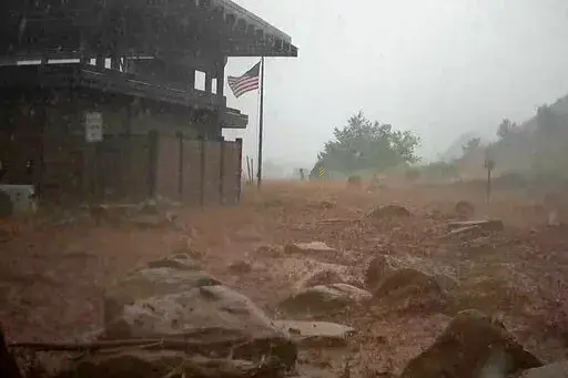 In this photo provided by the National Park Service is the scene of a flash flood in Zion National Park, Utah, on June 29, 2021. Authorities have been searching for days for Jetal Agnihotri, 29, of Tucson, Ariz., reported missing after being swept away by floodwaters in the park as strong seasonal rain storms hit parts of the U.S. Southwest. (National Park Service via AP, File)
