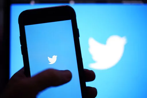 The Twitter application is seen on a digital device, April 25, 2022, in San Diego. Twitter said Tuesday, July 12, 2022, that it has sued Elon Musk to force him to complete the $44 billion acquisition of the social media company. (AP Photo/Gregory Bull, File)
