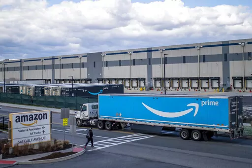 A truck arrives at the Amazon warehouse facility on the Staten Island borough of New York, April 1, 2022. Amazon is barring off-duty warehouse workers from the company’s facilities, a move organizers say can hamper union drives. (AP Photo/Eduardo Munoz Alvarez, File)