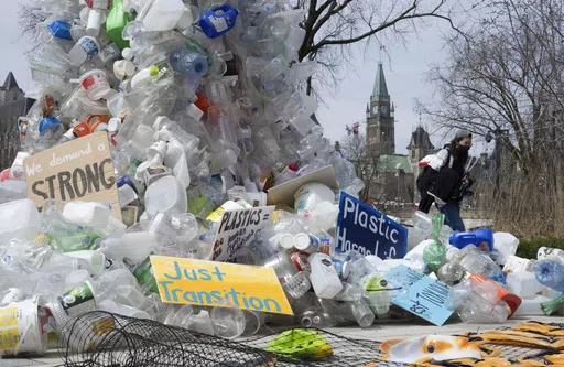 A person walks past an art installation outside a United Nations conference on plastics on April 23, 2024, in Ottawa, Ontario. (Adrian Wyld/The Canadian Press via AP, File)