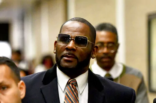 Musician R. Kelly, center, leaves the Daley Center after a hearing in his child support case on May 8, 2019, in Chicago. Closing arguments are scheduled Monday, Sept. 12, 2022 for R. Kelly and two co-defendants in the R&B singer’s trial on federal charges of trial-fixing, child pornography and enticing minors for sex, with jury deliberations to follow. (AP Photo/Matt Marton, File)