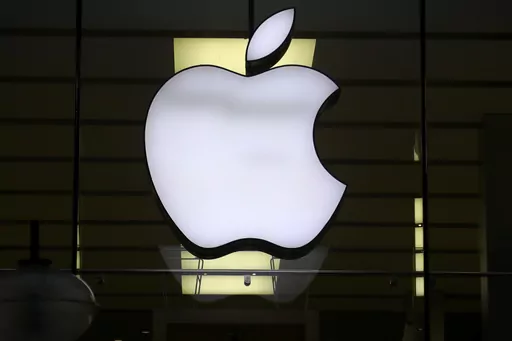 The Apple logo is illuminated at a store in the city center of Munich, Germany, Dec. 16, 2020. A potential redesign of two Apple Watch models, the Series 9 and Ultra 2, that would exclude the blood oxygen sensor has been approved by the U.S. Customs and Border Protection, according to a Monday, Jan. 15, 2024, court filing by Masimo, a Southern California company pursuing the patent claim. (AP Photo/Matthias Schrader, File)