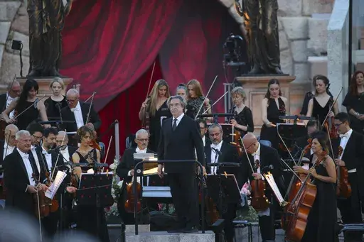 Italian Conductor Riccardo Muti acknowledges applause at a gala concert at the Verona Arena to celebrate the recognition by UNESCO of the Italian art of opera singing, in Verona, Italy, Friday, June 7, 2024. (Paola Garbuio/LaPresse via AP)