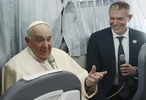 Pope Francis meets the journalists during a press conference aboard the airplane directed to Rome, at the end of his pastoral visit to Hungary, Sunday, April 30, 2023. (Vincenzo Pinto/Pool Photo Via AP)