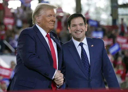 Republican presidential nominee former President Donald Trump greets Sen. Marco Rubio, R-Fla., during a campaign rally at J.S. Dorton Arena, Nov. 4, 2024, in Raleigh, N.C. (AP Photo/Evan Vucci, File)