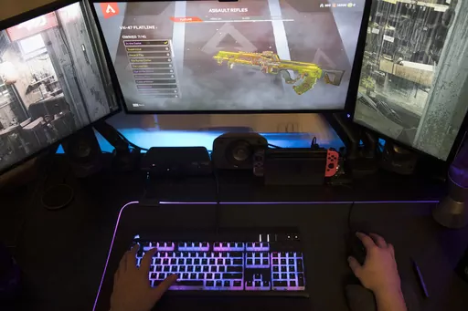 A gamer plays Electronic Arts' "Apex Legends" in Jersey City, N.J., on March 6, 2019. The enthusiasm military personnel have for gaming, and the risk that carries is in the spotlight after Jack Teixeira, a 21-year-old Massachusetts Air National Guardsman, was charged with illegally taking and posting highly classified material on Discord, a social media platform that started as a hangout for gamers. Online gaming forums have long been a particular worry of the military because of their lure for 