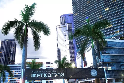 Signage for the FTX Arena, where the Miami Heat basketball team plays, is visible Saturday, Nov. 12, 2022, in Miami. Sam Bankman-Fried received numerous plaudits as he rapidly achieved superstar status as the head of cryptocurrency exchange FTX: the savior of crypto, the newest force in Democratic politics and potentially the world’s first trillionaire. Now the comments about the 30-year-old aren’t so kind after FTX filed for bankruptcy protection Friday, Nov. 11 leaving his investors and cu