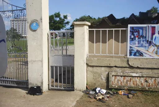 A view of sandles outside Kings Assembly Pentecostal church, following a stampede in Port Harcourt, Nigeria, Saturday, May 28, 2022. Police say a stampede at a church charity event in southern Nigeria has left at least 31 people dead and seven injured. One witness said the dead included a pregnant woman and “many children.” Police said the stampede took place at an annual “Shop for Free” program organized by the Kings Assembly Pentecostal church in Rivers state. Such events are common in