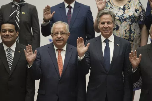 Guatemalan Foreign Minister Carlos Ramiro Martinez Alvarado, left, and U.S. Secretary of State Antony Blinken pose for a group photo at the National Palace in Guatemala City, Tuesday, May 7, 2024. Blinken is in Guatemala for a two-day visit where he will attend a regional meeting on irregular migration. (AP Photo/Moises Castillo)