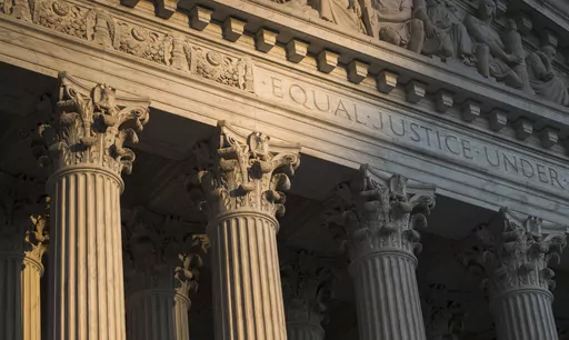 The Supreme Court in Washington is seen at sunset on Oct. 10, 2017. In a monthslong inquiry, which included reviewing tens of thousands of pages of documents from more than 100 public records requests, The Associated Press has examined what happens behind the scenes when Supreme Court justices travel to colleges and universities for lectures and other events. The AP learned the identities of donors and politicians invited to events with justices, details about the perks that have accompanied the