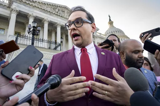 Rep. George Santos, R-N.Y., speaks to reporters outside after an effort to expel him from the House, at the Capitol in Washington, Wednesday, May 17, 2023. Santos wants to protect family members by asking that the courts keep his bond cosigners secret as he fights criminal charges, his lawyer told a Long Island federal judge Friday, June 9, as he asked her to reverse a magistrate judge's decision to make the names public. (AP Photo/J. Scott Applewhite, File)