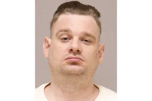 This image provided by the Kent County, Mich., Jail. shows Adam Fox. The attorney for Fox, the leader of a plot to kidnap Michigan Gov. Gretchen Whitmer says his client should not be sentenced to life in prison because prosecutors overstated his role in the plot and have created a “false narrative of a terrifying para-military leader." Attorney Christopher Gibbons said Friday, Dec. 9, 2022 in Fox's sentencing memorandum that the government had employed “histrionic descriptions” of Fox to o