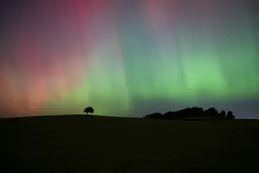 The Northern Lights, also known as the Aurora Borealis, are seen in the sky near Knaresborough, England, Friday, Oct. 11, 2024. (Andrew Hawkes via AP)