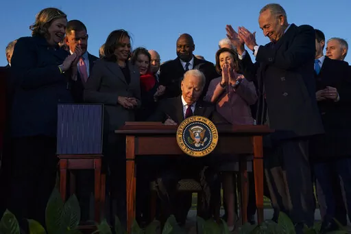 President Joe Biden signs the "Infrastructure Investment and Jobs Act" during an event on the South Lawn of the White House, Nov. 15, 2021, in Washington. Biden will deliver his State of the Union address to a joint session of Congress on Tuesday, March 1, 2022. (AP Photo/Evan Vucci, File)