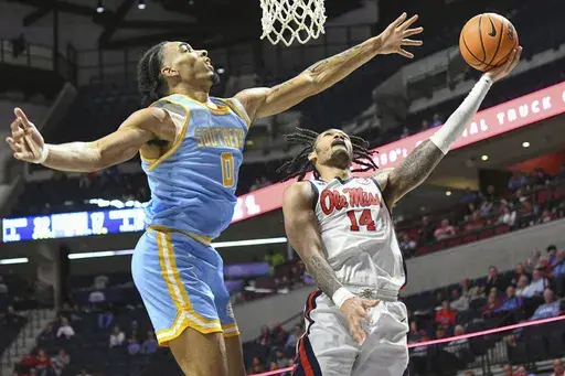Mississippi guard Dre Davis (14) shoots against Southern University center Brentay Noel (0) during the first half of an NCAA college basketball game in Oxford, Miss., Tuesday, Dec. 17, 2024. (AP Photo/Bruce Newman)