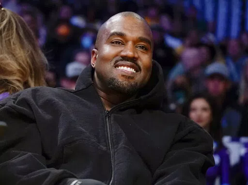 Kanye West watches the first half of an NBA basketball game between the Washington Wizards and the Los Angeles Lakers in Los Angeles, on March 11, 2022 A completed documentary about the rapper formerly known as Kanye West has been shelved amid his recent slew of antisemitic remarks.. (AP Photo/Ashley Landis, File)
