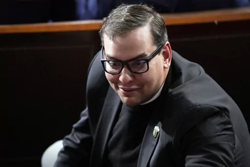 Rep. George Santos, R-N.Y., watches as Republicans try to elect Rep. Mike Johnson, R-La., to be the new House speaker, at the Capitol in Washington, Oct. 25, 2023. The House Ethics panel says it has found “substantial evidence” of lawbreaking by Republican Rep. George Santos of New York and has referred its findings to the Justice Department. (AP Photo/Alex Brandon, File)