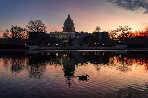 The Capitol is seen in Washington, early Wednesday, Dec. 14, 2022. Lawmakers leading the negotiations on a bill to fund the federal government for the current fiscal year say they've reached agreement on a "framework" that should allow them to complete work on the bill over the next week and avoid a government shutdown. (AP Photo/J. Scott Applewhite)