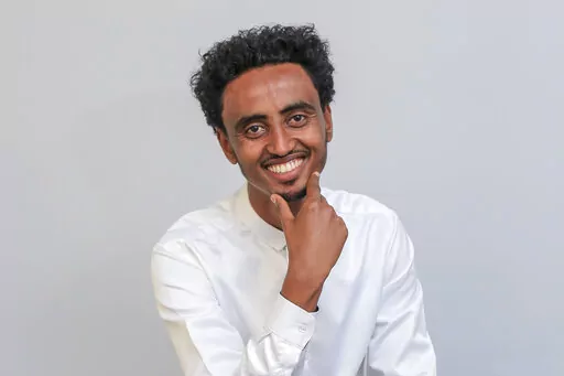 Freelance video journalist Amir Aman Kiyaro, who is accredited to The Associated Press and has been in detention since November 2021 without charges, poses for a photograph in Ethiopia on Oct. 17, 2021. Ethiopia is being urged on Monday, March 28, 2022, to uphold its international commitments to the freedoms of expression and the press as two lawmakers in the U.S. Congress joined press freedom advocates in calling for the immediate release of Kiyaro. (AP Photo, File)