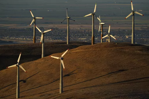 Wind turbines operate in Livermore, Calif., on Wednesday, Aug. 10, 2022. Across Europe companies are weighing up the U.S. Inflation Reduction Act's $375 billion in benefits for renewable industries against the European Union's fragmented response. (AP Photo/Godofredo A. Vásquez, File)