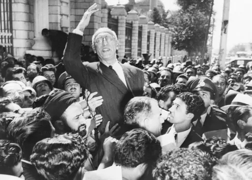 Prime Minister Mohammad Mossadegh rides on the shoulders of cheering crowds in Tehran's Majlis Square, outside the parliament building, after reiterating his oil nationalization views to his supporters on Sept. 27, 1951. While revealing new details about one of the most famed CIA operations of all times, the spiriting out of six American diplomats who escaped the 1979 U.S. Embassy seizure in Iran, the intelligence agency for the first time has acknowledged something else as well. The CIA now off