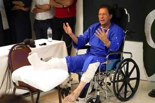Former Pakistani Prime Minister Imran Khan speaks during a news conference in Shaukat Khanum hospital, where is being treated for a gunshot wound in Lahore, Pakistan, Friday, Nov. 4, 2022.  Khan's protest march and rallies were peaceful until the afternoon attack on Thursday, when a gunman opened fire at his campaign truck. The shooting has raised concerns about growing political instability in Pakistan, a country with a history of political violence and assassinations. (AP Photo/K.M. Chaudhry)