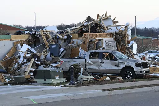 A damaged car sits by homes destroyed from severe weather in the West Creek Farms neighborhood on Sunday, Dec. 10, 2023, Clarksville, Tenn. If your home was hit by high water or a fire emergency, would your important papers be safe? Items like insurance information, birth and marriage certificates, passports, Social Security cards and estate planning paperwork should all be protected in case the worst happens. (AP Photo/Mark Zaleski, File)