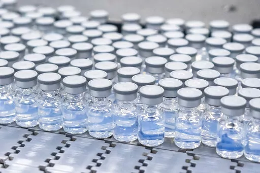 This August 2022 photo provided by Pfizer shows vials of the company's updated COVID-19 vaccine during production in Kalamazoo, Mich.  
 U.S. regulators have authorized updated COVID-19 boosters, the first to directly target today's most common omicron strain. The move on Wednesday, Aug. 13, 2022,  by the Food and Drug Administration tweaks the recipe of shots made by Pfizer and rival Moderna  that already have saved millions of lives.  (Pfizer via AP)