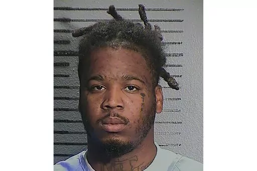 This Feb. 6, 2022, booking photo provided by the California Department of Corrections and Rehabilitation shows Smiley Allen Martin, two days before he was released to Sacramento County probation for his sentence on charges of corporal injury and assault likely to cause great bodily injury. Martin was arrested Tuesday, April 5, 2022, in connection with a mass shooting that killed six people in Sacramento, Calif. Martin is the brother of Dandrae Martin, the first suspect taken into custody in the 