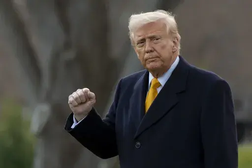 President Donald Trump pumps his fist before departing on Marine One from the South Lawn of the White House, Friday, March 7, 2025, in Washington. (AP Photo/Alex Brandon, File)