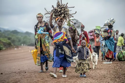 Residents flee fighting between M23 rebels and Congolese forces near Kibumba, some 20 kms ( 12 miles) North of Goma, Democratic Republic of Congo, on Oct. 29, 2022. Eastern Congo has been beset by conflict for years, with M23 one of more than 100 armed groups vying for a foothold in the mineral-rich area near the border with Rwanda (AP Photo/Moses Sawasawa, File)