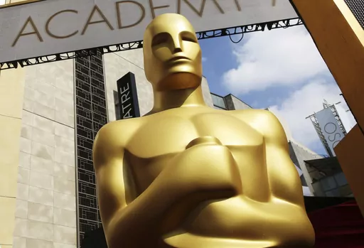 An Oscar statue appears outside the Dolby Theatre for the 87th Academy Awards in Los Angeles on Feb. 21, 2015. (Photo by Matt Sayles/Invision/AP, File)