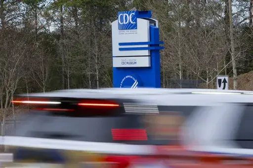 A sign with the CDC logo is displayed at the entrance to the agency's headquarters in Atlanta on Sunday, March 2, 2025. (Miguel Martinez/Atlanta Journal-Constitution via AP)