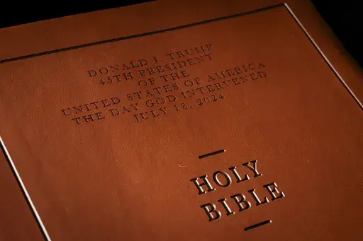 The front cover of Republican presidential nominee former President Donald Trump's "God Bless the USA" Bible in Washington, Tuesday, Oct. 8, 2024. (AP Photo/Ben Curtis)