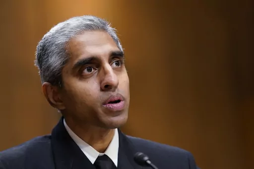 Surgeon General Dr. Vivek Murthy testifies before the Senate Finance Committee on Capitol Hill in Washington, on Feb. 8, 2022, on youth mental health care. Widespread loneliness in the U.S. is posing health risks as deadly as smoking a dozen cigarettes daily, costing the health industry billions of dollars annually, the U.S. surgeon general said Tuesday in declaring the latest public health epidemic. About half of U.S. adults say they’ve experienced loneliness, Murthy said in a new, 81-page re