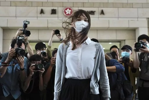 Hong Kong activist Agnes Chow arrives at a court in Hong Kong, Monday, Nov. 23, 2020. One of Hong Kong’s best-known pro-democracy activists, who moved to Canada to pursue further studies, said she would not return to the city to meet her bail conditions, becoming the latest politician to flee Hong Kong under Beijing's crackdown on dissidents. (AP Photo/Vincent Yu, File)
