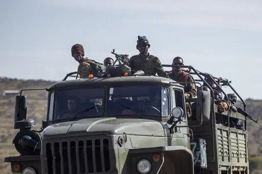Ethiopian government soldiers ride in the back of a truck on a road near Agula, north of Mekele, in the Tigray region of northern Ethiopia on May 8, 2021. Authorities in Ethiopia's northern Tigray region alleged Wednesday, Aug. 24, 2022 that Ethiopia's military launched a "large-scale" offensive for the first time in a year, while Ethiopia's military spokesman did not immediately respond to questions. (AP Photo/Ben Curtis, File)