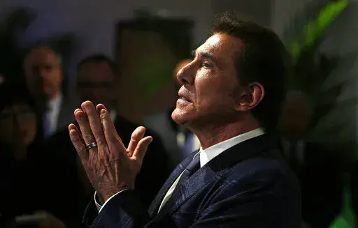 Former Las Vegas casino mogul Steve Wynn gestures at a news conference in Medford, Mass., March 15, 2016. An effort by Nevada casino regulators to impose a $500,000 fine and discipline former Las Vegas casino mogul Wynn over allegations of workplace sexual misconduct had new life Friday, April 1, 2022, after a state Supreme Court decision in a jurisdictional question. Wynn denies all allegations against him. (AP Photo/Charles Krupa, File)