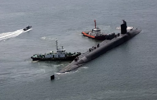 The nuclear-powered submarine USS Michigan approaches a naval base in Busan, South Korea, Friday, June 16, 2023. The United States deployed the nuclear-powered submarine capable of carrying about 150 Tomahawk missiles to South Korea on Friday, a day after North Korea resumed missile tests in protest of the U.S.-South Korean live-fire drills. (Gang Duck-chul/Yonhap via AP)