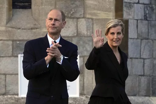 Britain's Prince Edward and Sophie, Countess of Wessex, wave to mourners outside the Windsor Castle in Windsor, England, on Sept. 16, 2022. Britain’s King Charles III has made his youngest brother the Duke of Edinburgh, passing on a title held by their late father, Prince Philip. Buckingham Palace said the title was conferred on Prince Edward on Friday, March 10, 2023, his 59th birthday. (AP Photo/Kin Cheung, File)