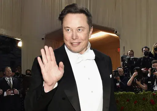 Elon Musk attends The Metropolitan Museum of Art's Costume Institute benefit gala on May 2, 2022, in New York. Musk threatened to walk away from his $44 billion bid to buy Twitter on Monday, June 6, 2022, the latest sign that his plan to overhaul the social media platform may be really starting to fray. (Photo by Evan Agostini/Invision/AP, File)