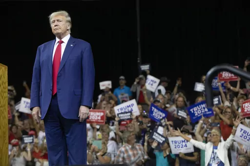 Former President Donald Trump stands as the crowd cheers at the South Dakota Republican Party Monumental Leaders rally Friday, Sept. 8, 2023, in Rapid City, S.D. (AP Photo/Toby Brusseau)