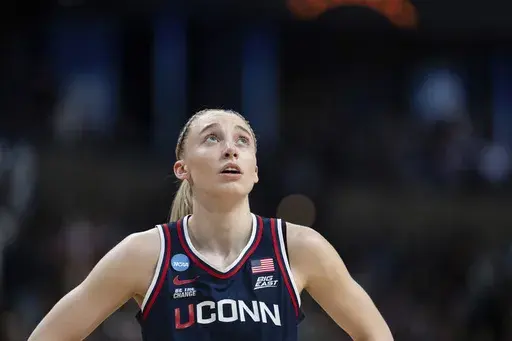 UConn guard Paige Bueckers looks up during the first half against Southern California in the Elite Eight of the NCAA college basketball tournament Monday, March 31, 2025, in Spokane, Wash. (AP Photo/Jenny Kane)