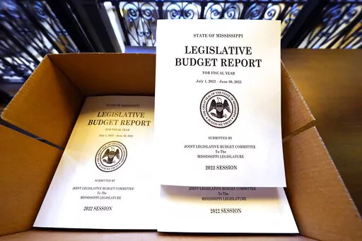 A box of Legislative Budget Reports for the 2023 fiscal year await distribution at the Capitol in Jackson, Miss., Monday, Jan. 3, 2022. Lawmakers begin the latest legislative session on Tuesday, at noon. (AP Photo/Rogelio V. Solis)
